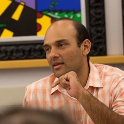 Image of Vidit Munshi Speaking During Meeting.