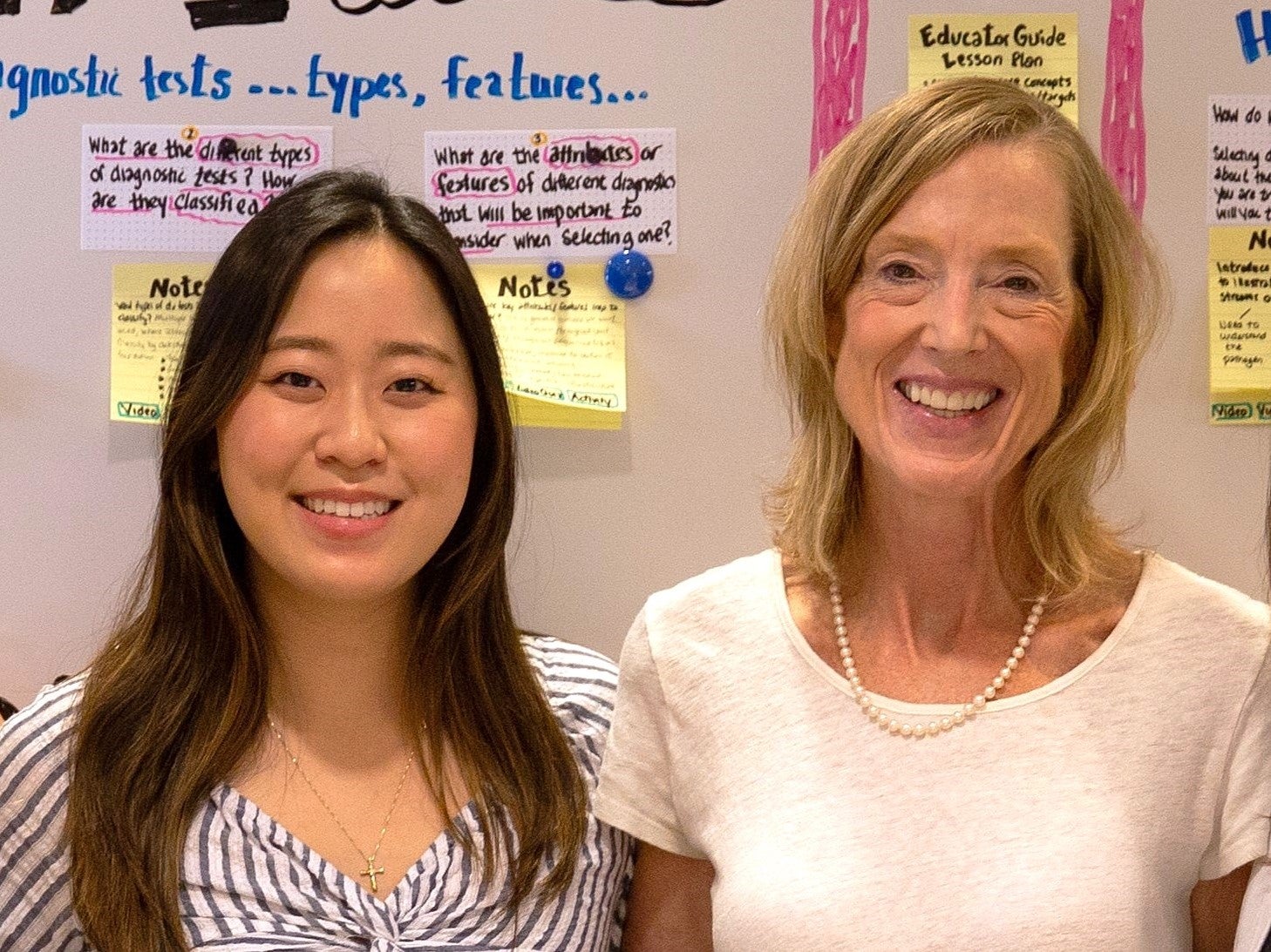 Janice Jhang (left) and Sue J. Goldie (right) smile at camera