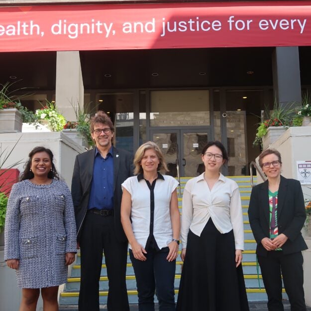 Members of the RDS 286 teaching team stand in front of the Harvard Chan School building, smiling at camera. PIctured left to right: Rhea Saksena, Uwe Siebert, Sibylle Puntscher, Hanxuan (Astrid) Yu, Beate Jahn