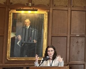 Jenna Rogers presents at podium