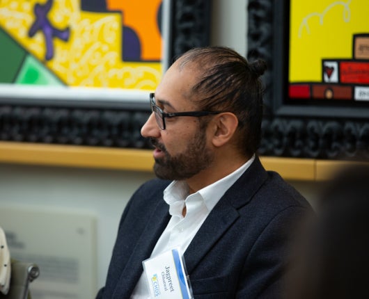 Jagpreet Chhatwal speaking during meeting