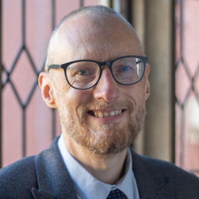 Headshot of Mark Strong