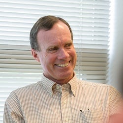 James Hammitt smiling during meeting.