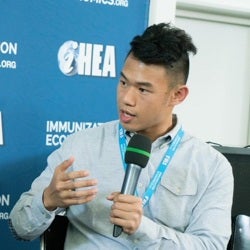 Christian Suharlim holding microphone and talking at iHEA
